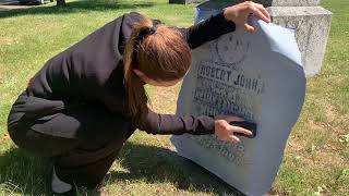 Beechwood Staff member doing a rubbing on an old monument